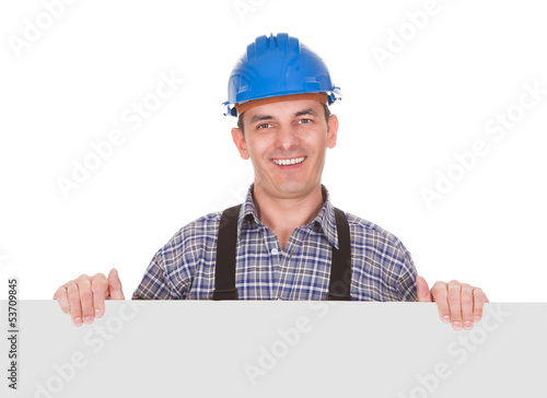 Photo: Portrait Of Male Worker With Placard Portrait Of Male Worker With Placard