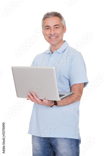Photo: Man Working On Laptop Man Working On Laptop