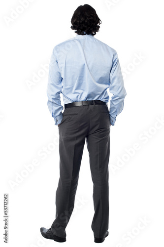 Photo: Casual businessman facing the wall Casual businessman facing the wall