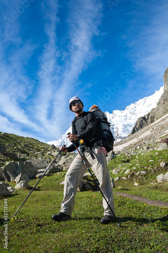 Photo: Hikier is climbing mountain in Caucasus mountains in Bezengi reg Hikier is climbing mountain in Caucasus mountains in Bezengi reg