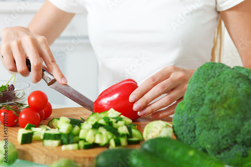Photo: Woman's hands cutting vegetables Woman's hands cutting vegetables