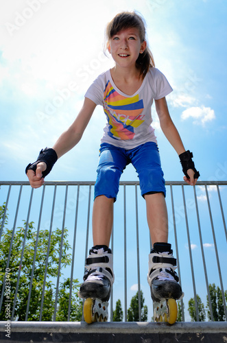 Photo: Young girl rollerskating Young girl rollerskating