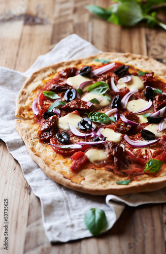 Photo: Pizza with fresh and dried tomatoes Pizza with fresh and dried tomatoes