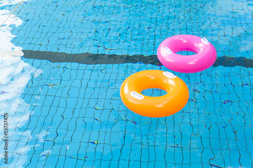 Photo: colorful swimming pool rings on the water colorful swimming pool rings on the water