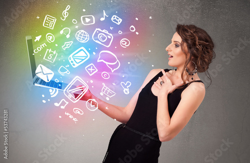 Photo: Young lady holding notebook with colorful hand drawn multimedia Young lady holding notebook with colorful hand drawn multimedia