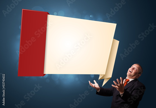 Photo: funny businessman presenting modern origami copy space funny businessman presenting modern origami copy space