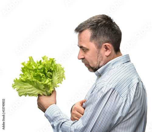 Photo: Man holding lettuce isolated on white Man holding lettuce isolated on white