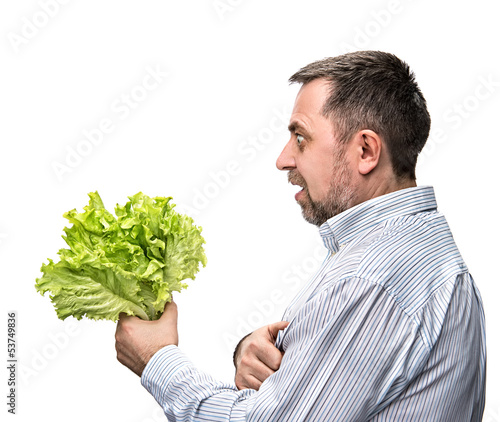 Photo: Man holding lettuce isolated on white Man holding lettuce isolated on white