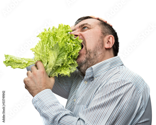 Photo: Man holding lettuce isolated on white Man holding lettuce isolated on white