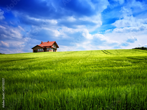 Photo: Summer house on a green hill Summer house on a green hill