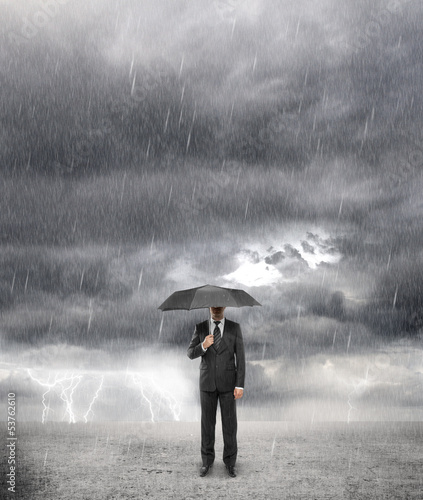 Photo: businessman in storm businessman in storm