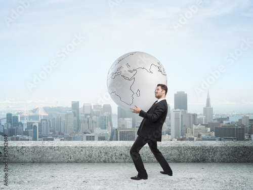 Photo: businessman holding globe businessman holding globe
