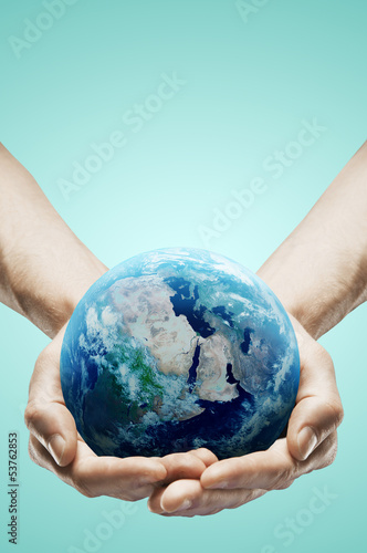 Photo: hands holding earth hands holding earth