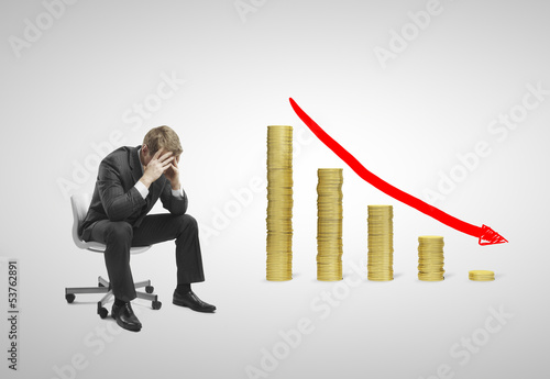 Photo: falling money graph falling money graph