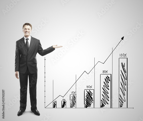 Photo: businessman shows graph businessman shows graph