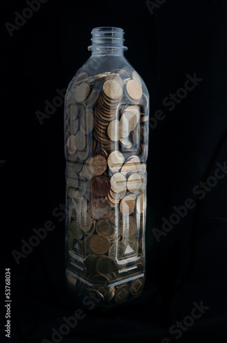 Photo: Bottle with coins Bottle with coins