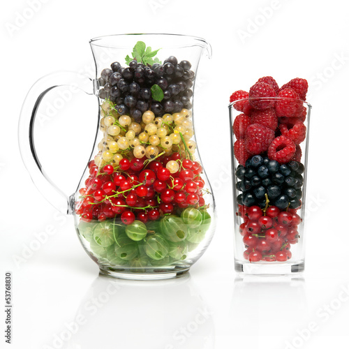 Photo: glass jug with berries glass jug with berries