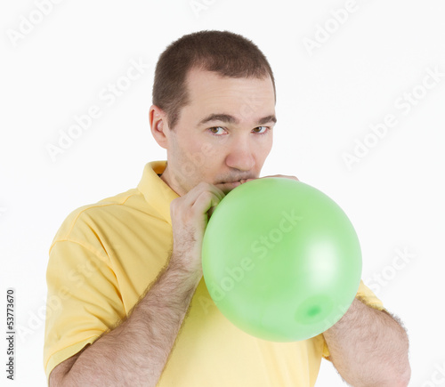 Photo: man inflates the balloon man inflates the balloon