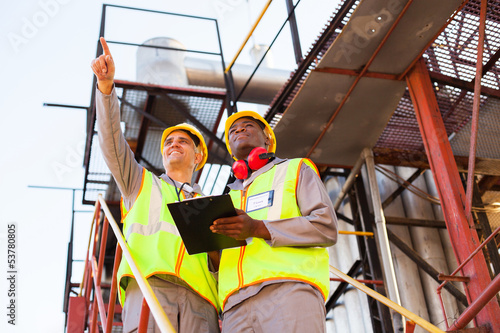 Photo: workers working at petrochemical plant workers working at petrochemical plant
