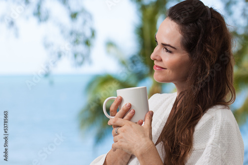 Photo: Woman enjoying morning coffee Woman enjoying morning coffee