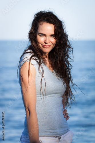 Photo: Portrait of attractive woman on beach Portrait of attractive woman on beach