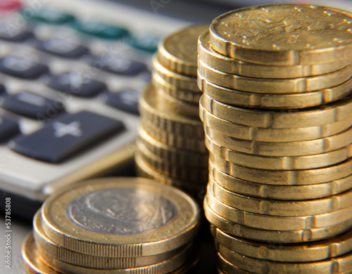 Photo: coins and calculator coins and calculator