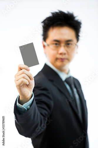 Photo: Businessman holding business name card Businessman holding business name card