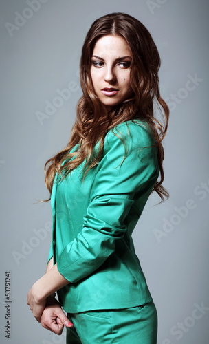 Photo: Beautiful woman in modern bright suit Beautiful woman in modern bright suit