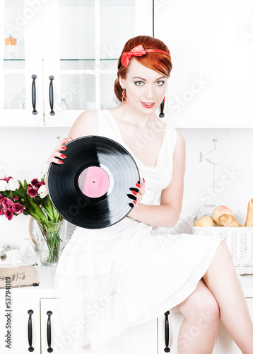 Photo: Beautiful woman with vinyl record Beautiful woman with vinyl record
