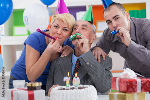 Photo: family celebrating 70th birthday family celebrating 70th birthday