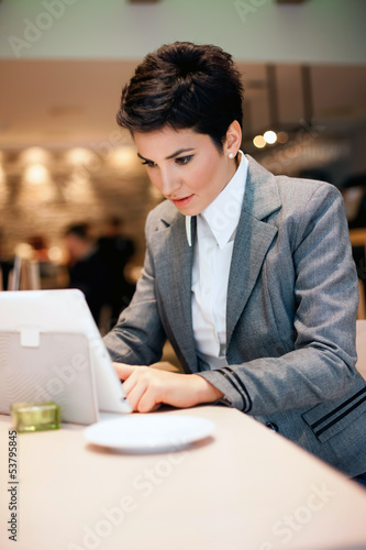 Photo: Young business woman with tablet Young business woman with tablet