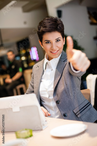 Photo: success businesswoman in cafe success businesswoman in cafe