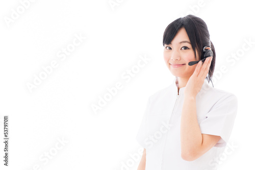 Photo: attractive asian nurse with headset attractive asian nurse with headset