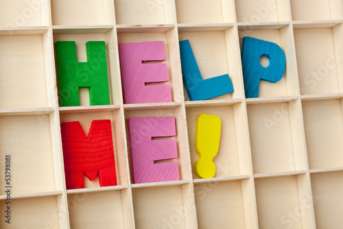 Photo: Wooden letter blocks forming the words HELP ME! Wooden letter blocks forming the words HELP ME!