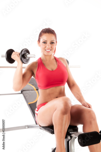 Photo: Beautiful fitness woman - isolated over white background Beautiful fitness woman - isolated over white background