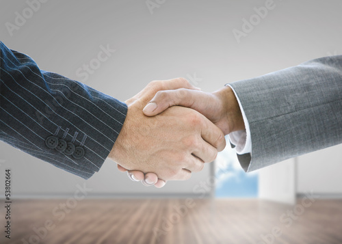 Photo: Close up of businessmen shaking hands Close up of businessmen shaking hands