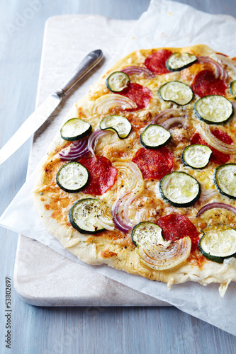 Photo: Pizza with zucchini, onion and salami Pizza with zucchini, onion and salami