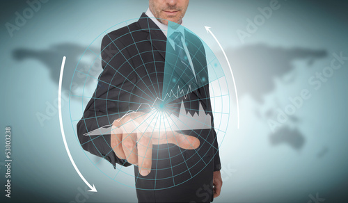 Photo: Businessman selecting a futuristic interface Businessman selecting a futuristic interface