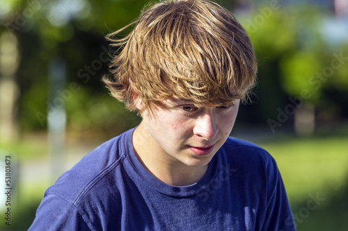 Photo: boy in motion is happy and smiles boy in motion is happy and smiles