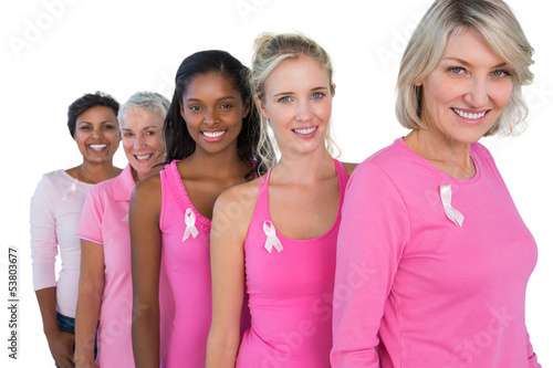 Photo: Group of diverse women wearing pink tops and ribbons for breast Group of diverse women wearing pink tops and ribbons for breast