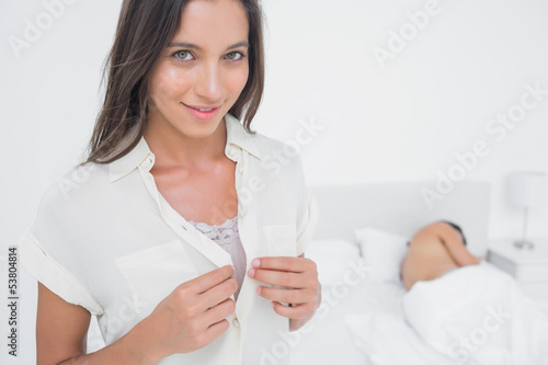 Photo: Portrait of a sexy woman sneaking out of bed Portrait of a sexy woman sneaking out of bed