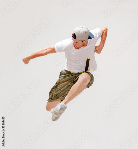 Photo: male dancer jumping in the air male dancer jumping in the air