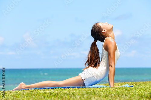 Photo: Fitness yoga woman stretching in cobra pose Fitness yoga woman stretching in cobra pose