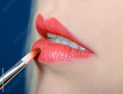 Photo: Female lips close up with lipstick Female lips close up with lipstick