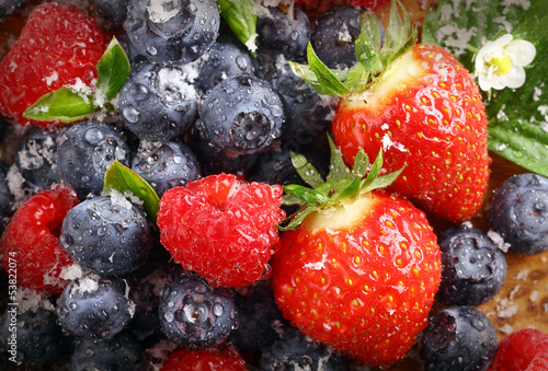 Photo: Berry background with water droplets Berry background with water droplets