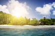 White coral sand on tropical beach. Mahe island, Seyshelles. Sun White coral sand on tropical beach. Mahe island, Seyshelles. Sun