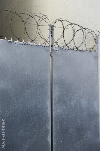 Photo: Closed door with razor wire Closed door with razor wire