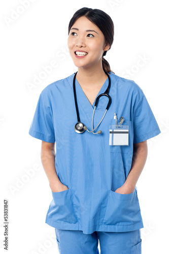 Photo: Female doctor in uniform looking away Female doctor in uniform looking away