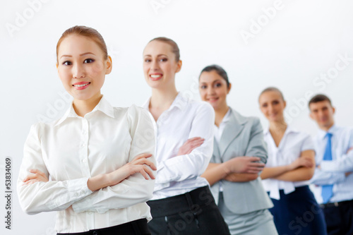 Photo: Group of business people standing in row Group of business people standing in row