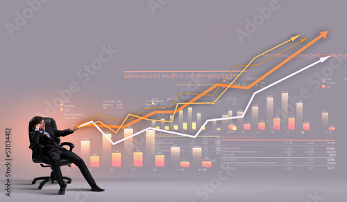 Photo: Businessman pulling graph Businessman pulling graph